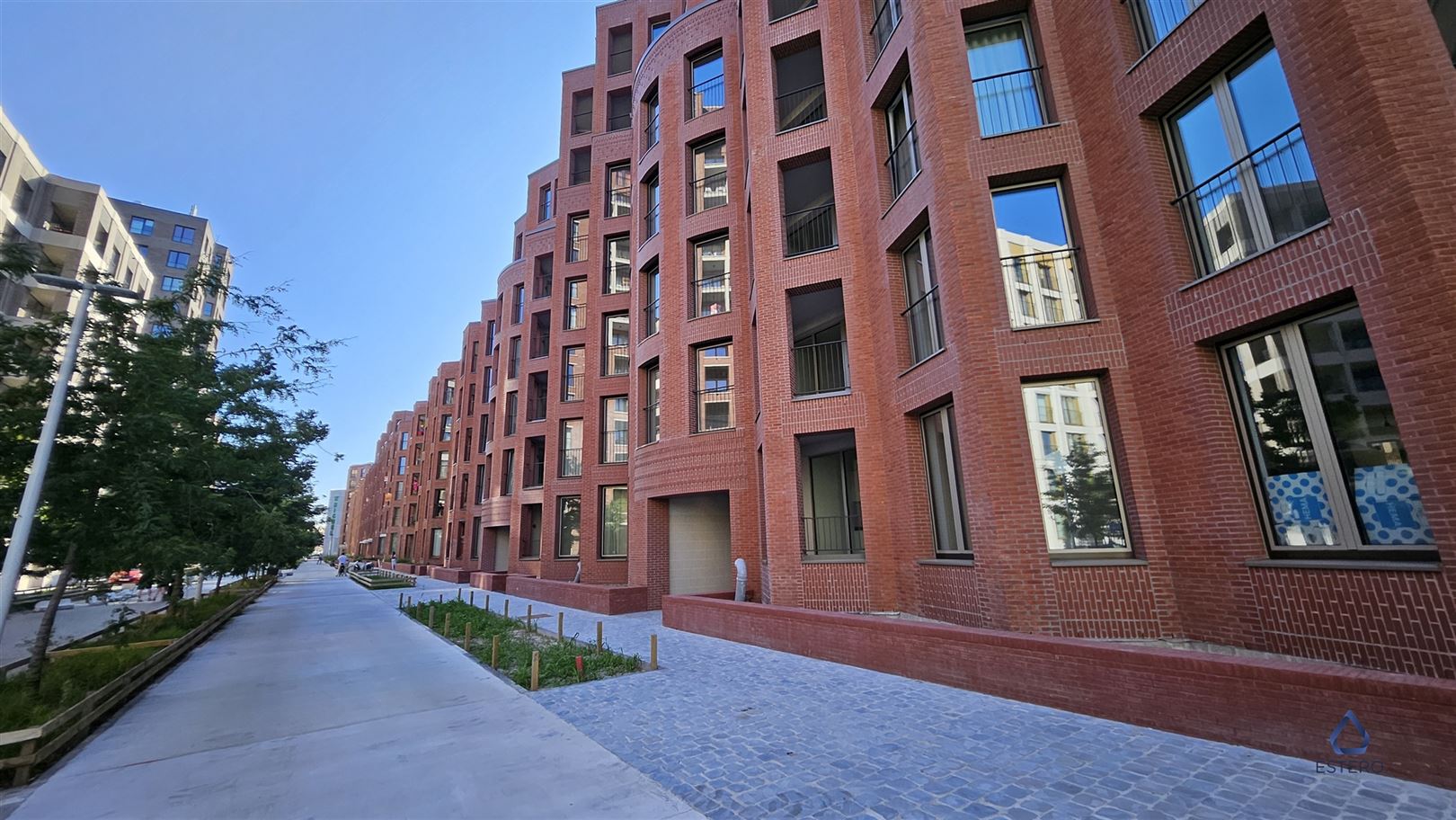 Modern nieuwbouwappt 2-SLK met Terras te Tour & Taxis foto {{pictureIndex}}