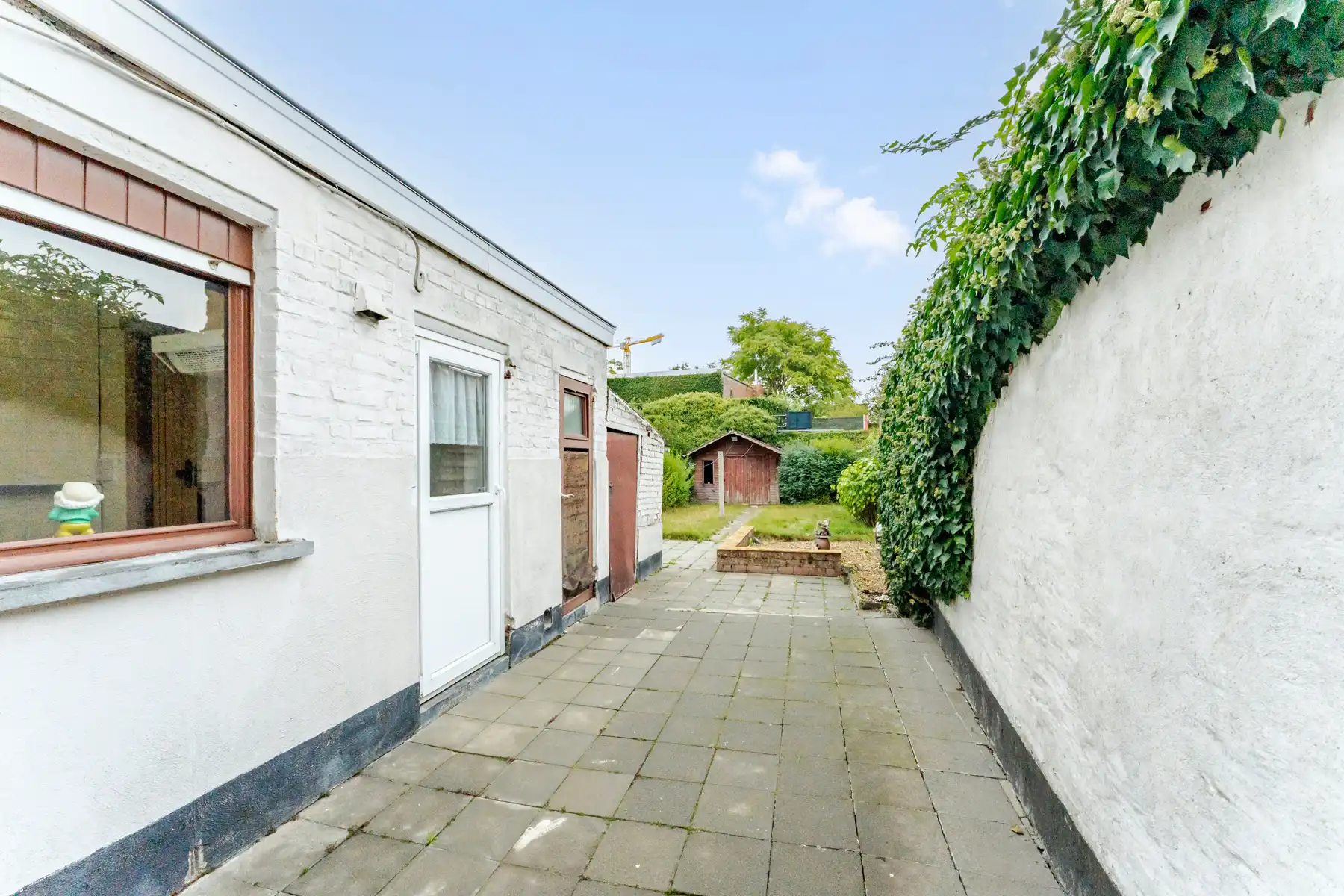 Centraal gelegen te renoveren woning met tuin foto 14
