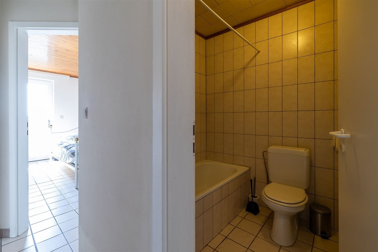Verzorgd gebouw met handelszaak en 2 apt foto 33