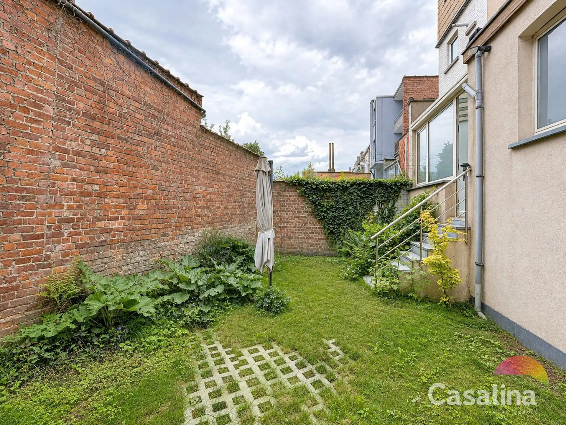 Luxe gelijkvloersappartement met stadstuin en garage box foto 2