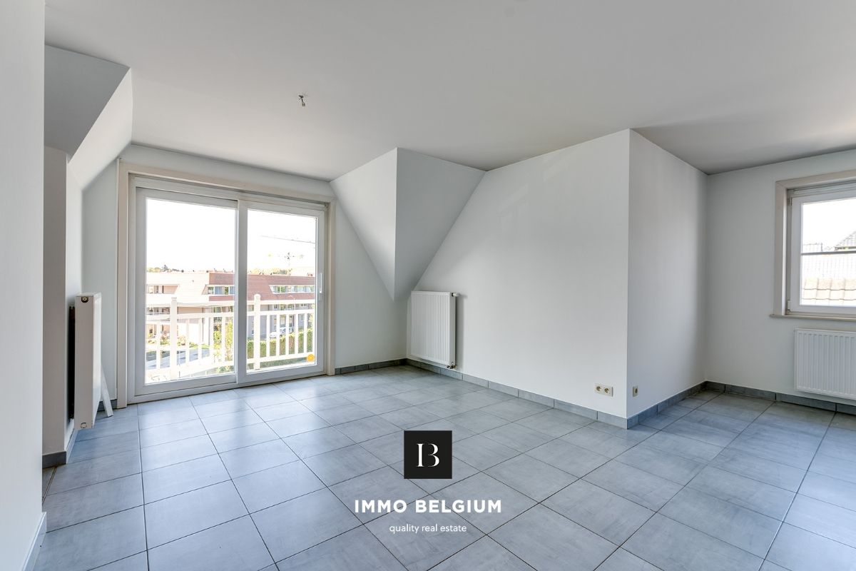 Ruim duplex appartement met 3 slaapkamers foto 3