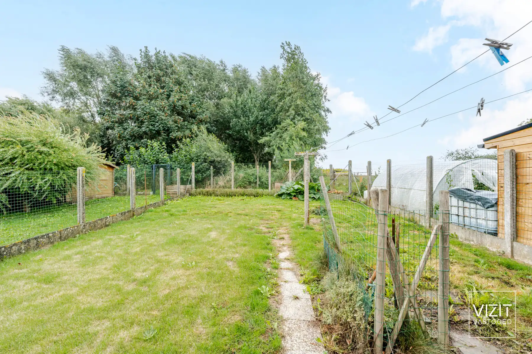 Halfopen woning met tuin en garage foto 28