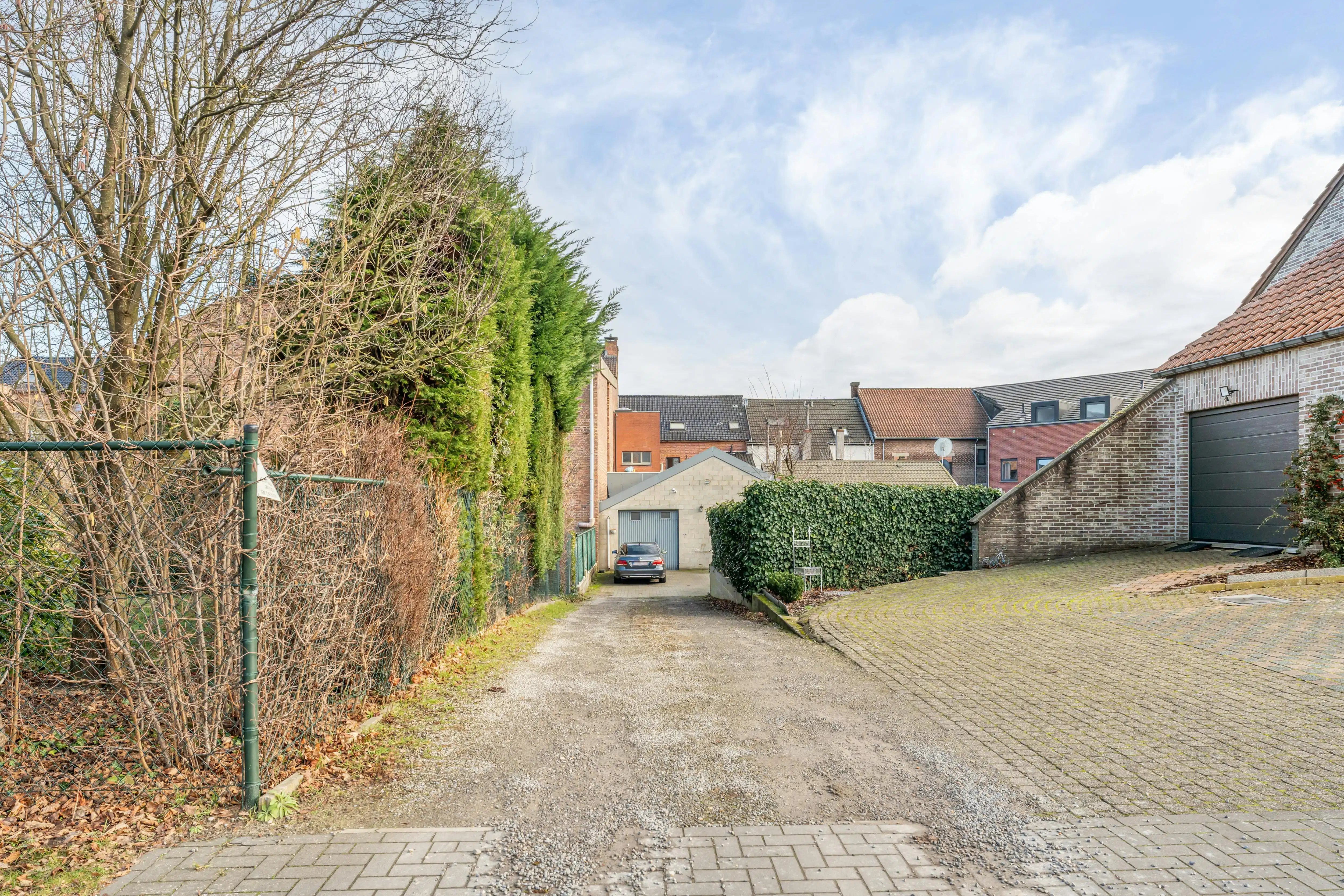 Rendabele opbrengsteigendom met handelspand, magazijn, woonst en 2 appartementen in Genk foto 26