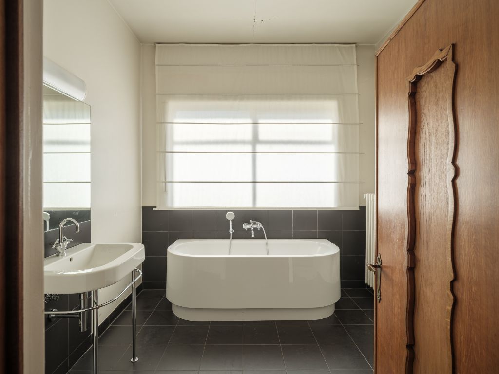 Voormalige dokterswoning met praktijkruimte en stadstuin foto 15