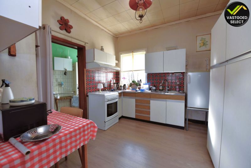Te koop: Te renoveren kangeroewonen met 4 slaapkamers, badkamer en garage in het centrum van Maldegem – 376 m² perceel foto 7