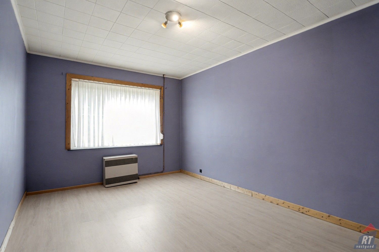 Gelijkvloerse halfopen woning met tuin en renovatiepotentieel in het hart van Sint-Truiden foto 9