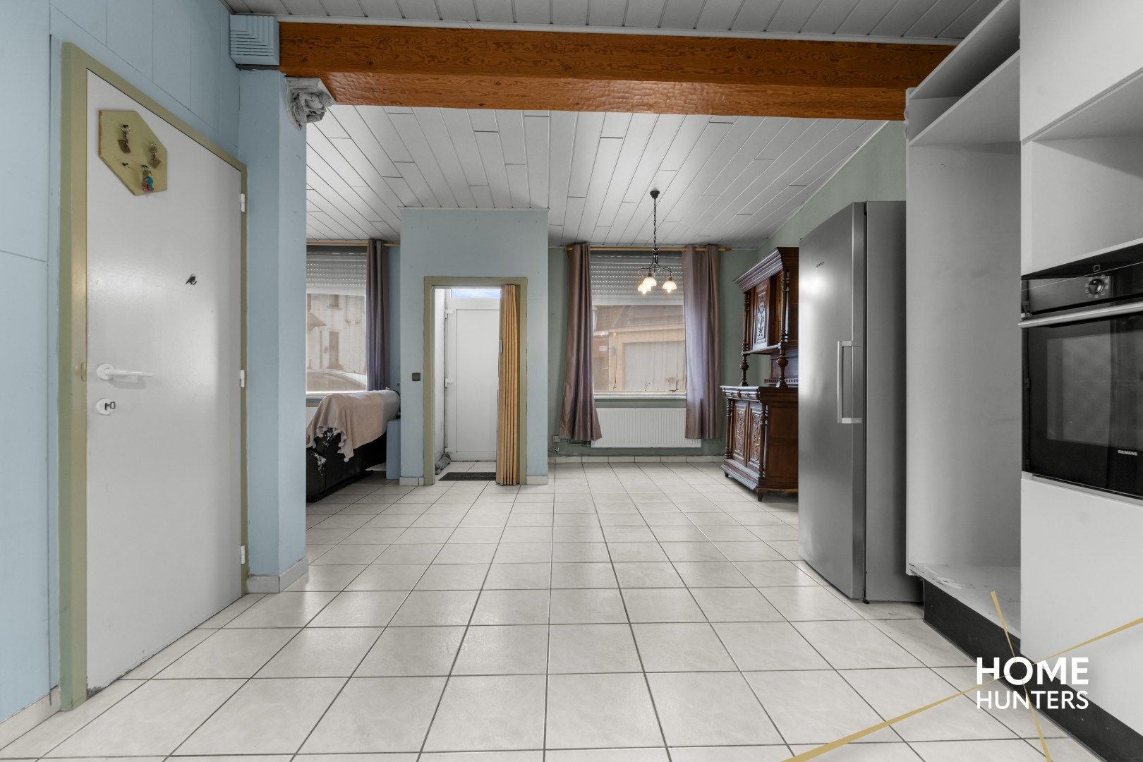 Op te frissen woning met charmante tuin in het hart van Mesen foto 4