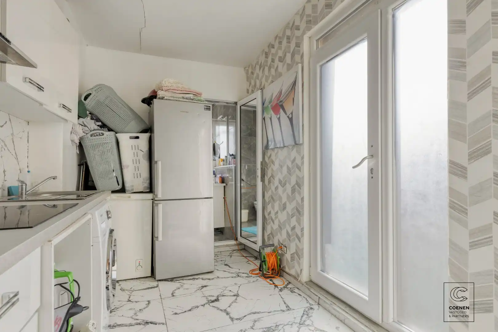 Ruime handelswoning, momenteel ingericht als handelsruimte en 2 appartementen op goede ligging te Antwerpen! foto 13