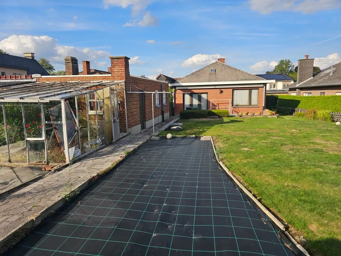 Open bebouwing met tuin en aparte garage foto 6