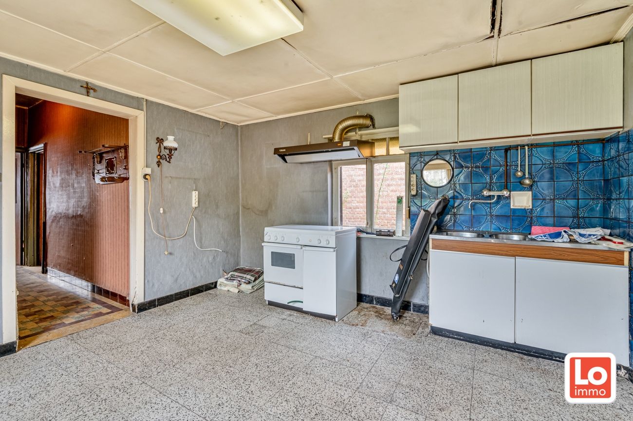 Landelijk gelegen halfopen afbraakwoning op groot perceel grond met open zicht in Zeveneken! foto 14