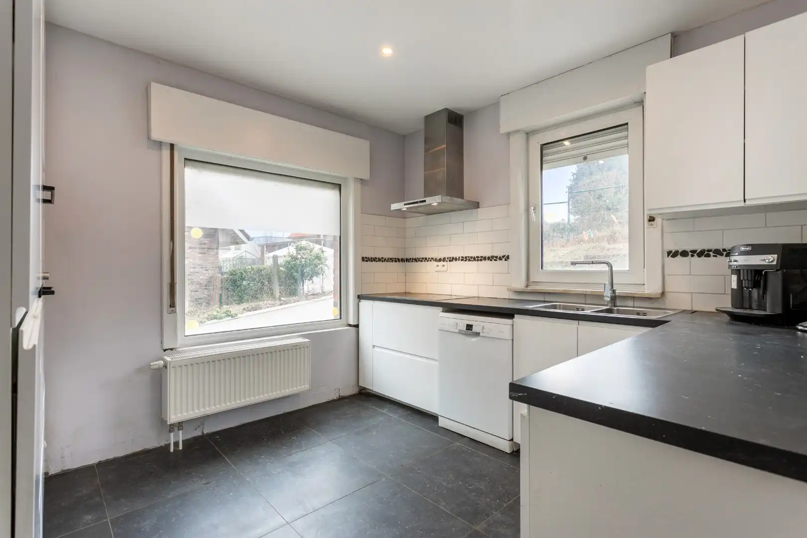 Solide woning met 3 slpks, tuin en garage te Buizingen foto 7