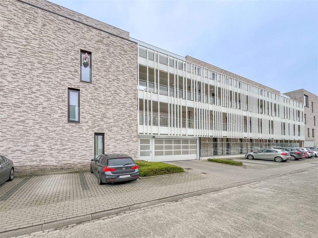 Ondergrondse staanplaats in centrum Herent! foto {{pictureIndex}}