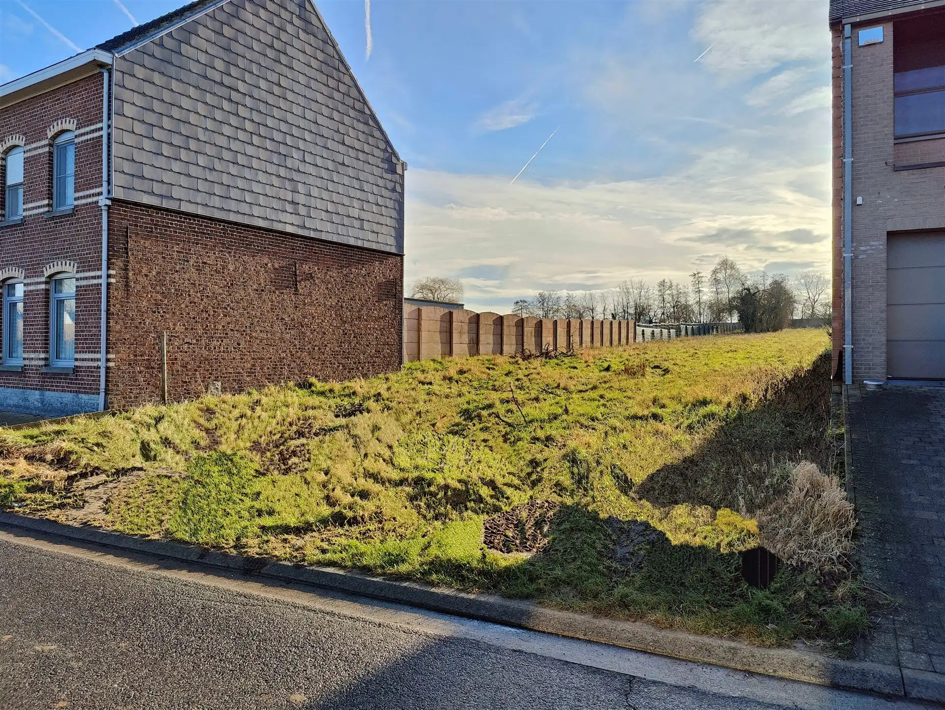 Exclusieve bouwgrond van 16a53ca voor een elegante driegevelwoning nabij Mazenzele foto {{pictureIndex}}