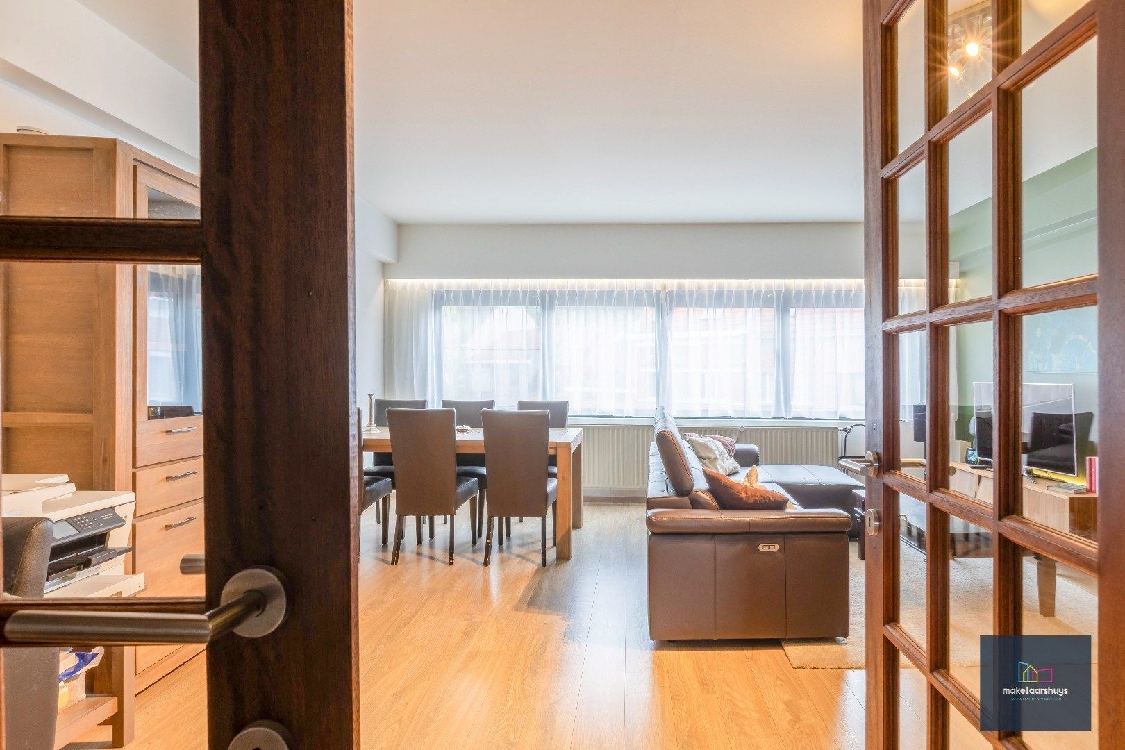 Heel ruime Instapklare woning in rij  met zonneterras en 2 staanplaatsen foto 8