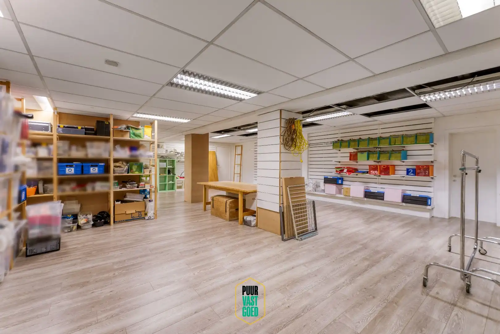 Riant appartement en studio boven grote handelsruimte  foto 9