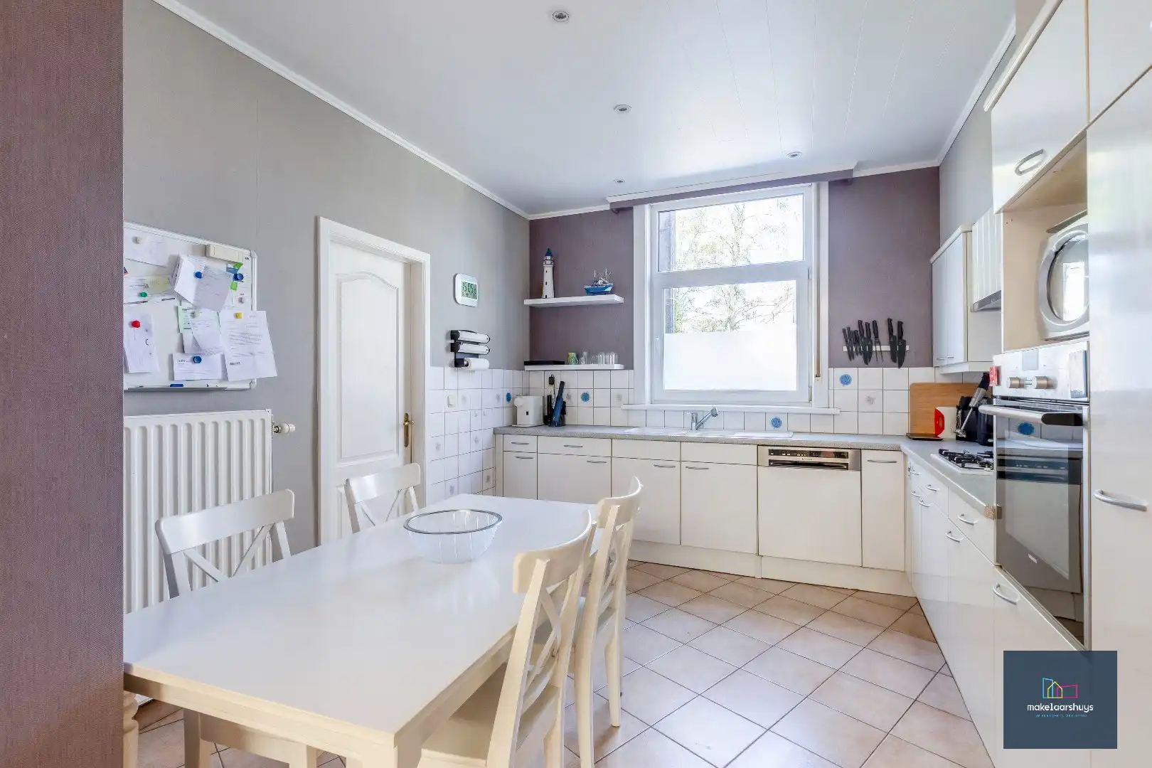 Goed onderhouden en ruime woning in rij met tuin/terras te Wondelgem foto 6
