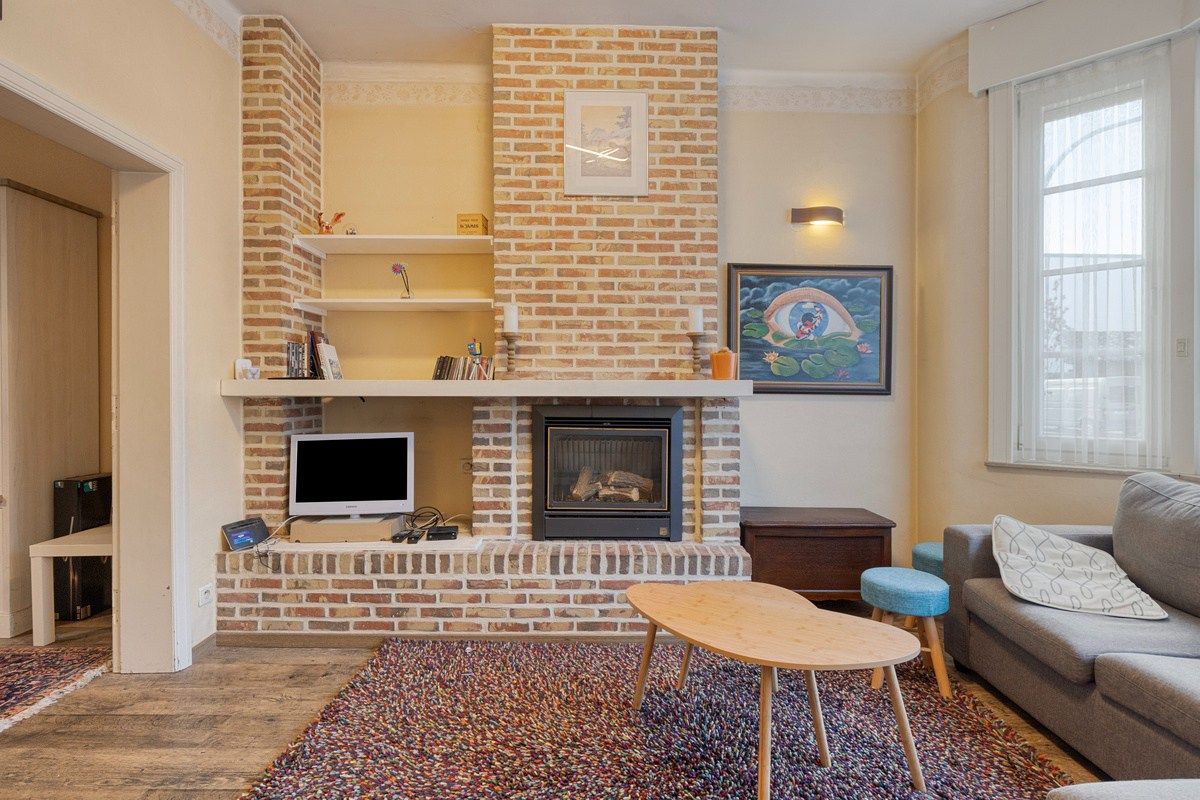 Charmante op te frissen woning met 4 slaapkamers en stadstuintje! foto 4