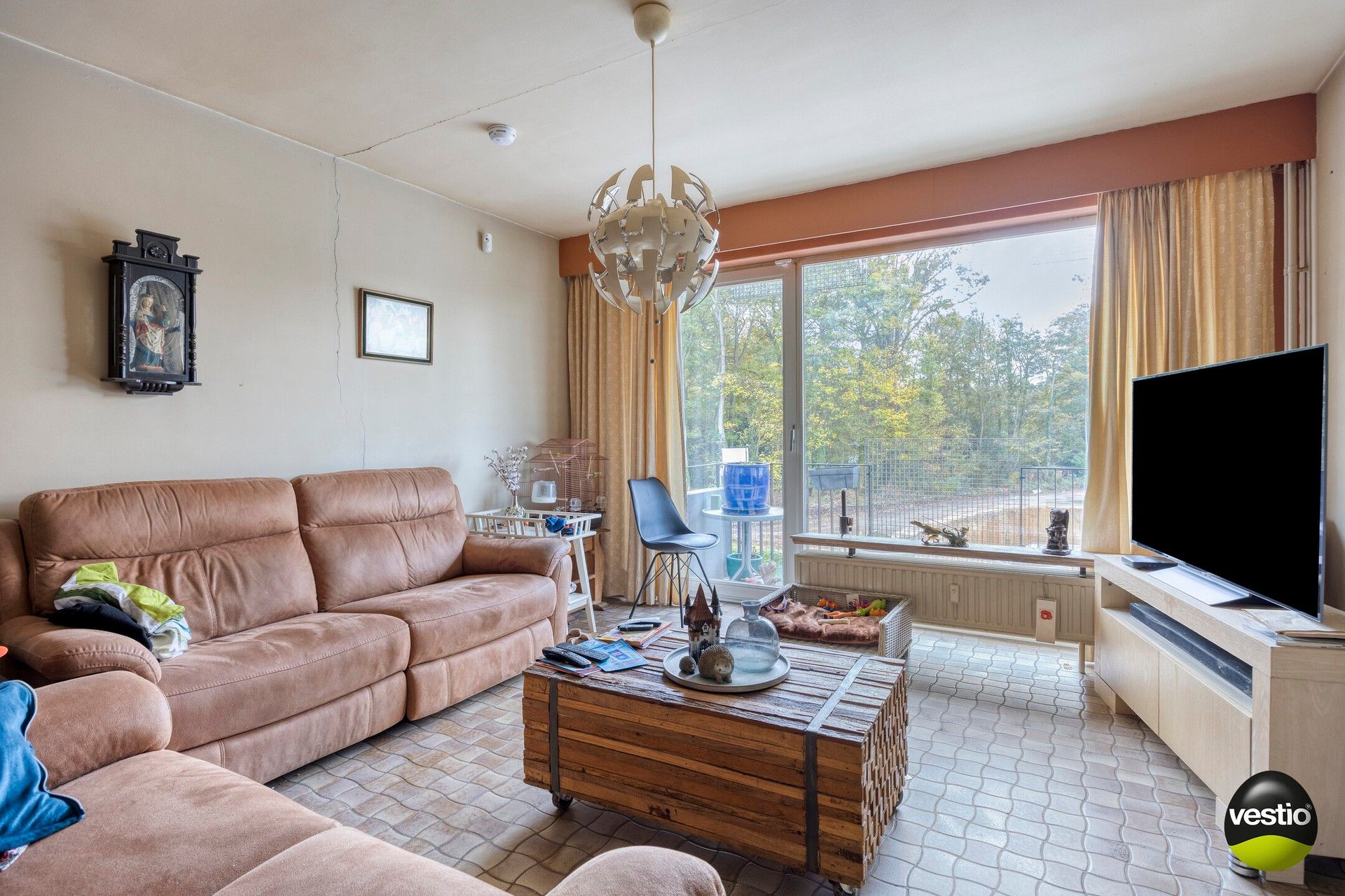 Te renoveren 2-slaapkamerappartement met terras, garagebox en kelder. foto {{pictureIndex}}