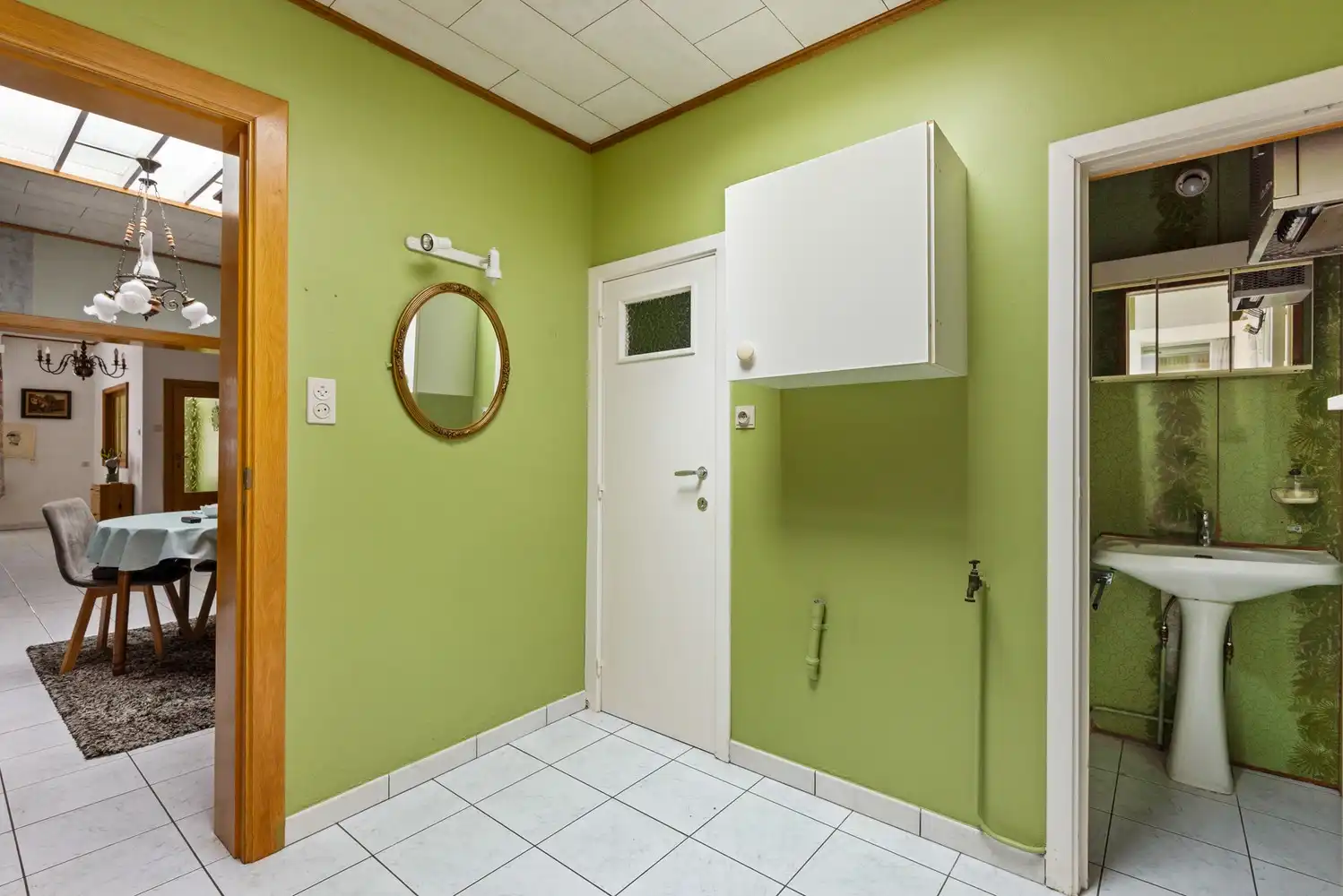 Te renoveren woning met 3 slaapkamers, veel potentieel en een groene tuin in Lier! foto 9