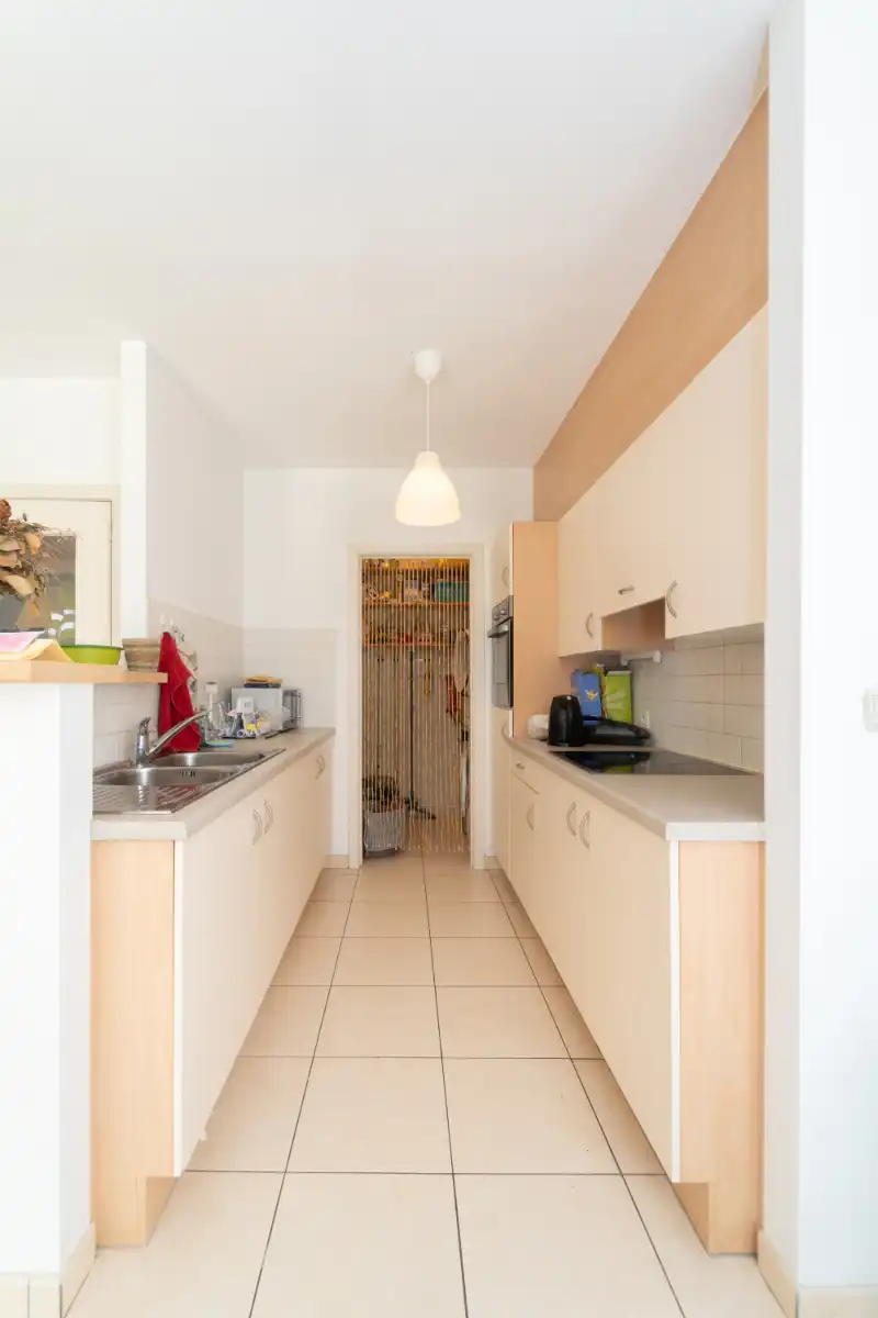 Gelijkvloers 2-slpk appartement met tuin! foto 10