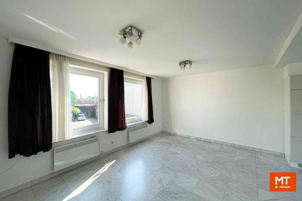 Veelzijdig gebouw bestaande uit handelsruimte, woning en appartement in het centrum van Wervik foto 22