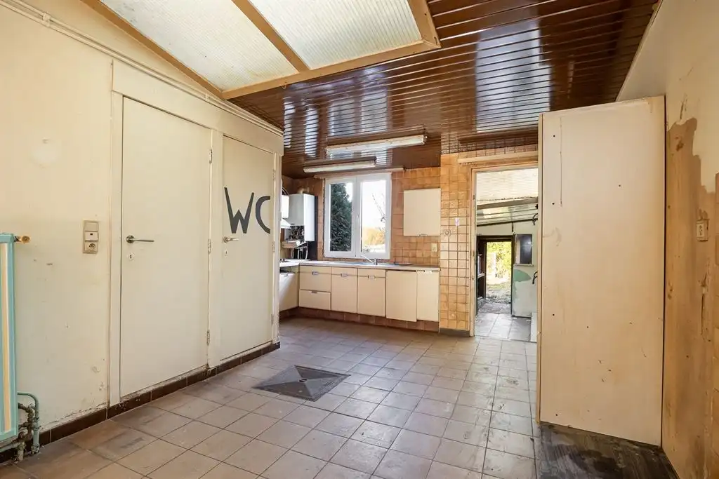 Te renoveren woning met grote tuin foto 4