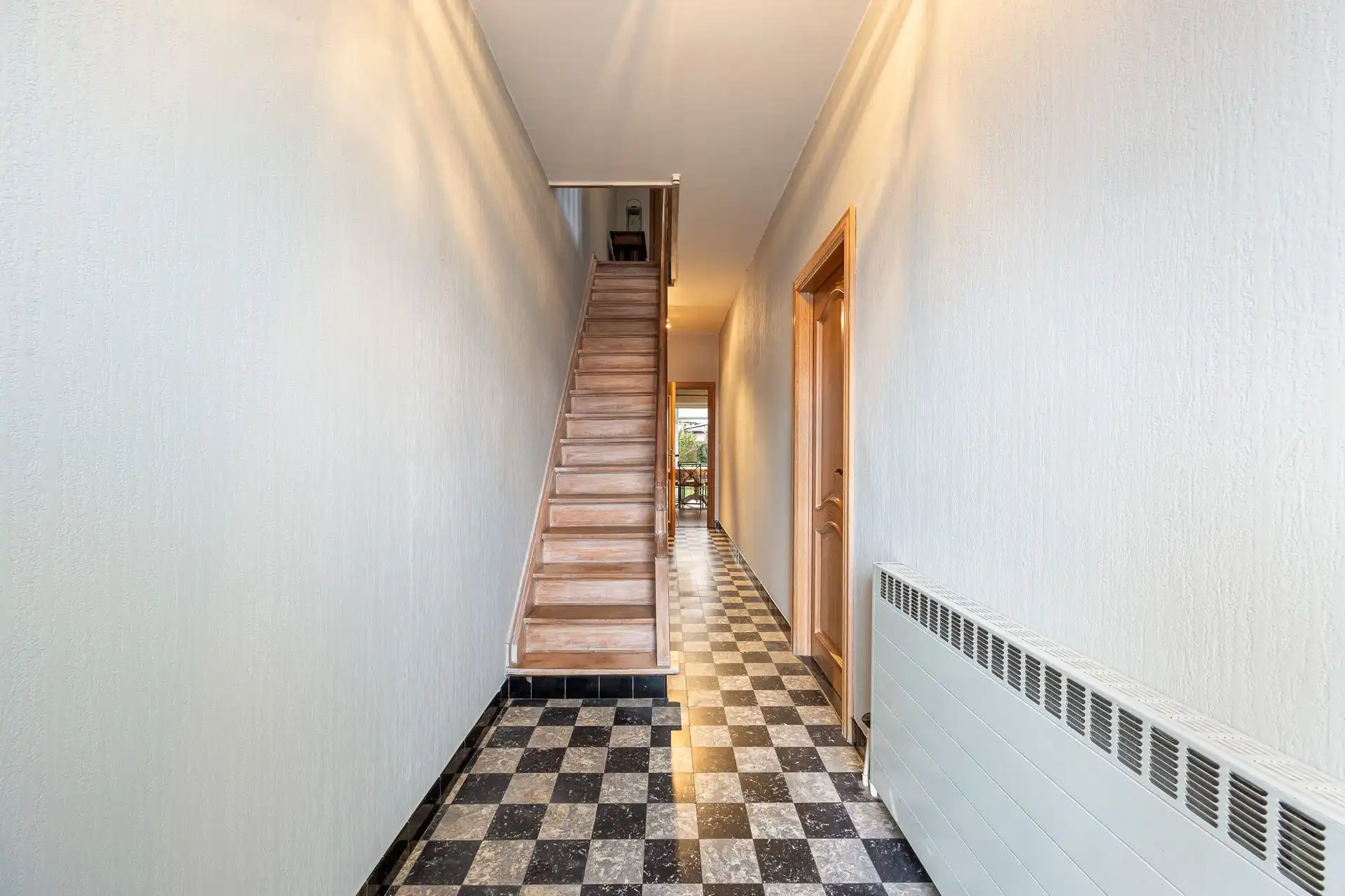 Halfopen bebouwing met potentieel in groene Bosheidelaan! foto 2