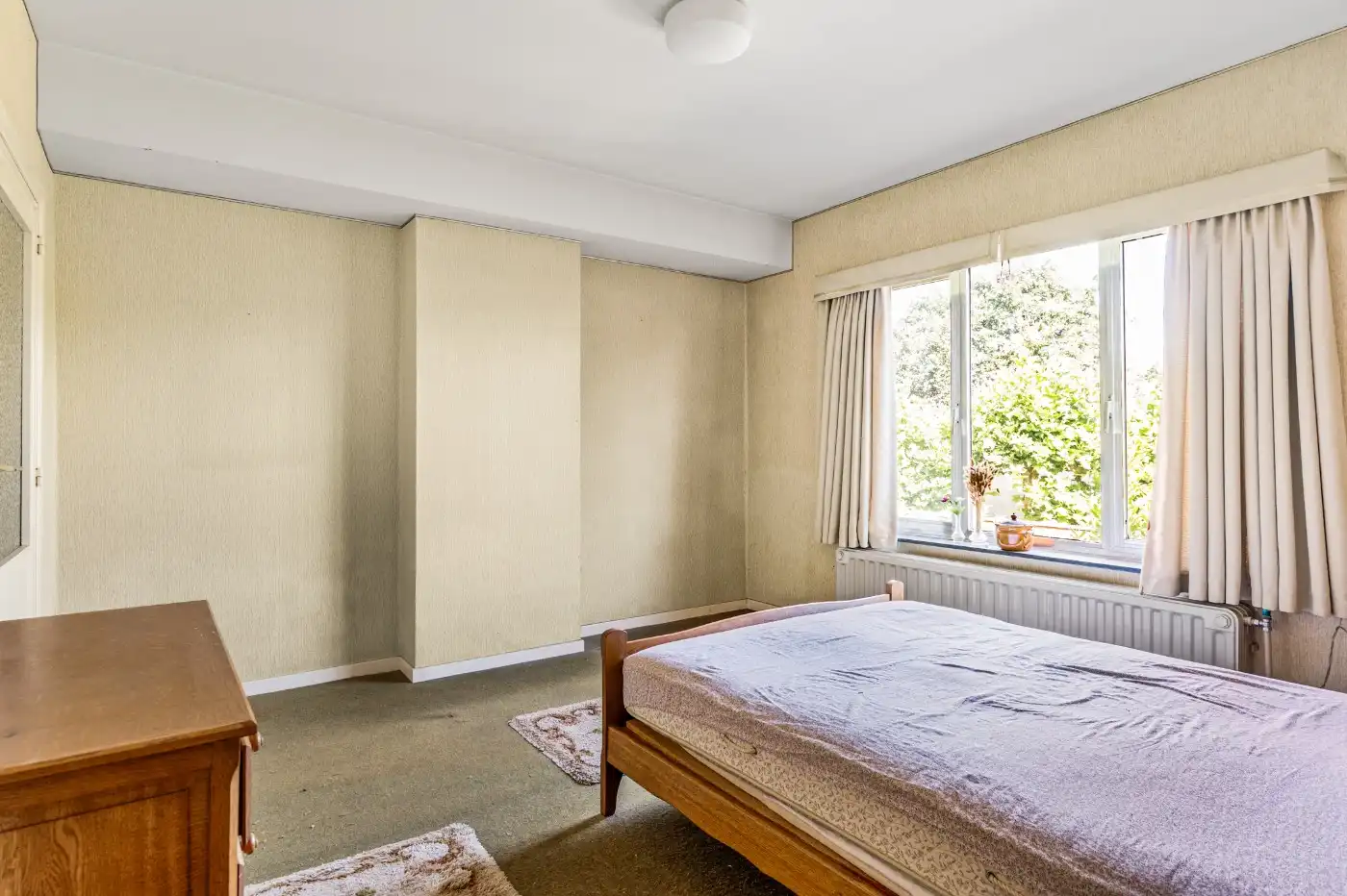 Te renoveren woning met 3 à 4 slpk., garage en tuintje foto 4