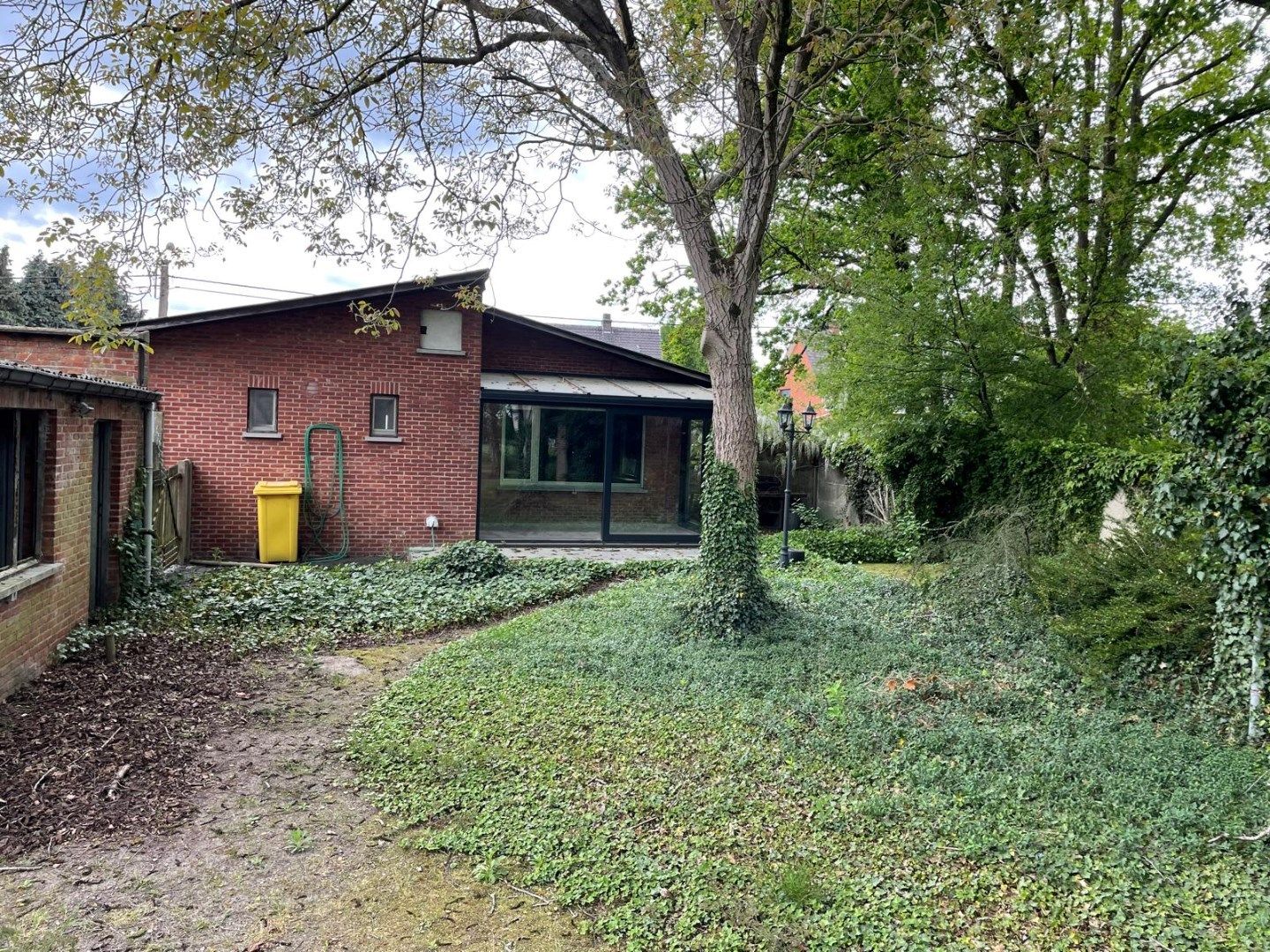 Gelijkvloerse woning in Mol met 1302m² tuin foto 5
