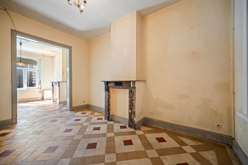 Te renoveren stadswoning met uitweg achteraan! foto 5