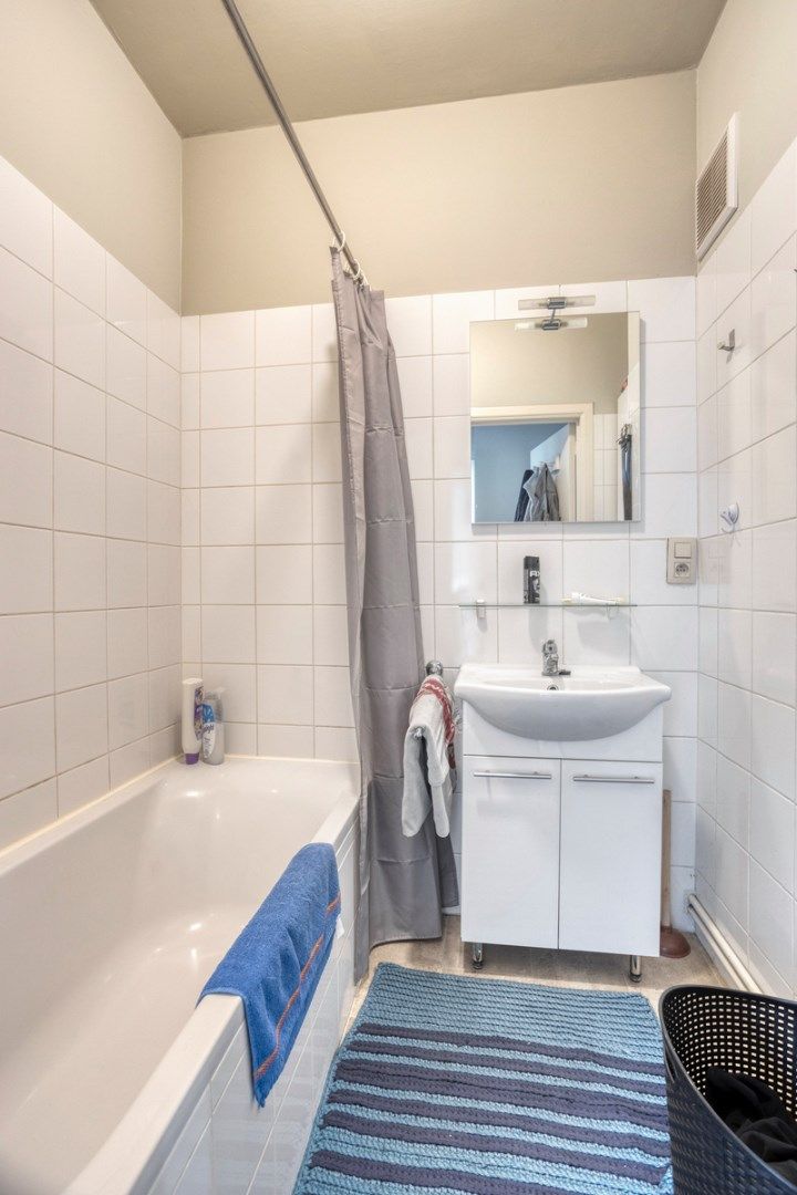 Opbrengsteigendom met 3 appartementen, garages en tuin foto 18