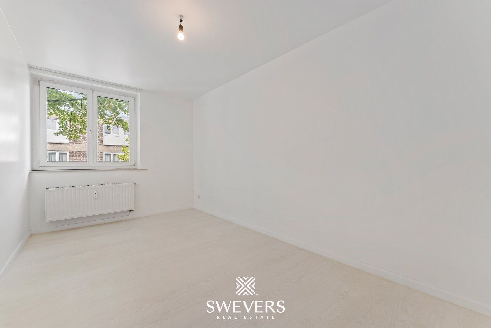 Instapklaar en energiezuinig 2-slaapkamerappartement in het centrum van Heppen foto 21