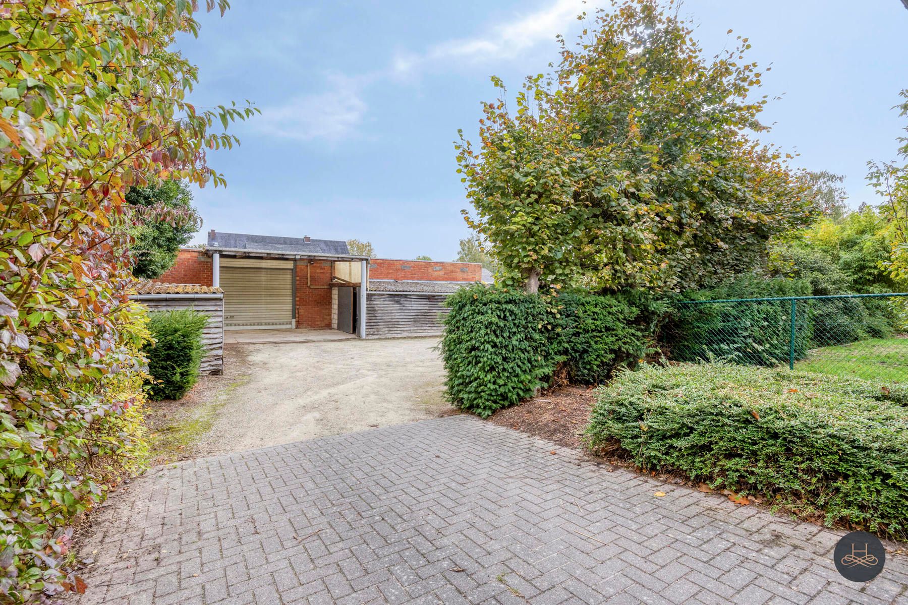 Ruime woonst met achterliggende loods - aandelenoverdracht foto 29