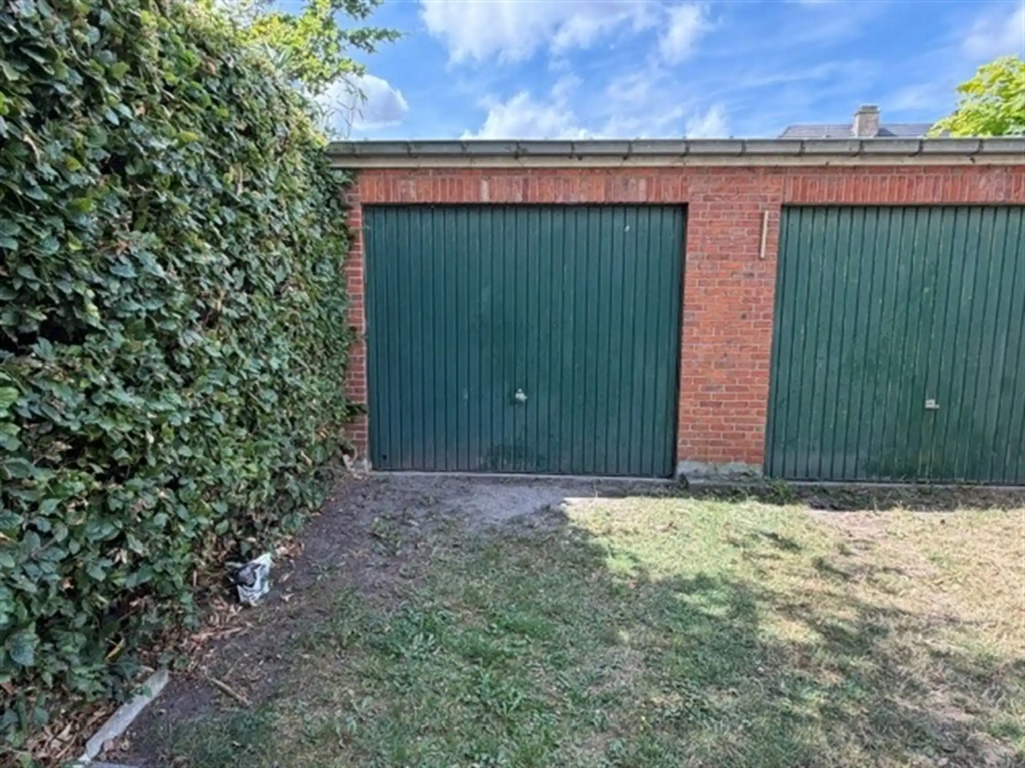 Zeer tof gelijkvloersappartement met tuin en garagebox foto 10