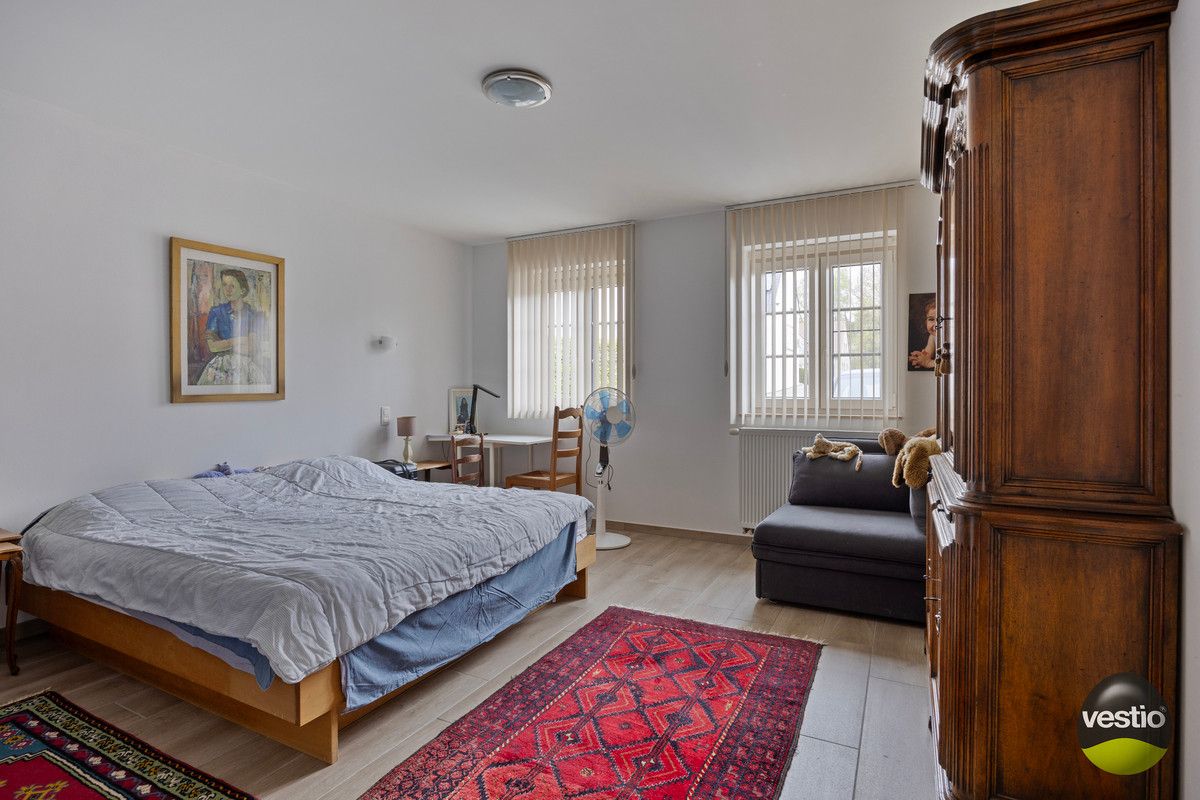 OPBRENGSTEIGENDOM VAN VERHUURD GELIJKVLOERS APPARTMENT MET 1 SLP NABIJ CENTRUM HOESELT. foto 8