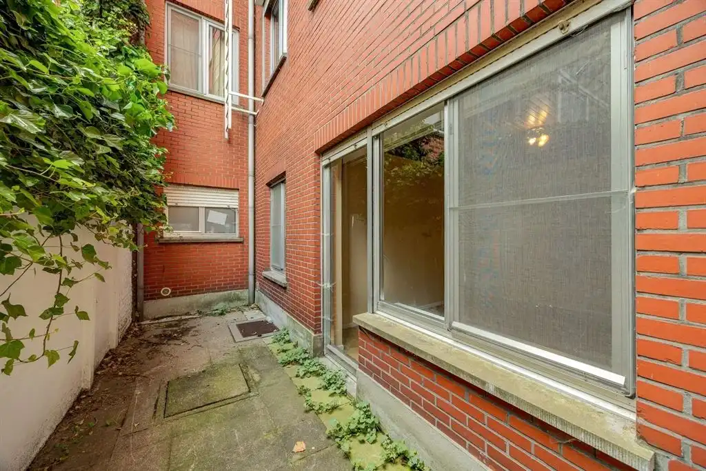Instapklaar gelijkvloersappartement met stadskoer foto 10
