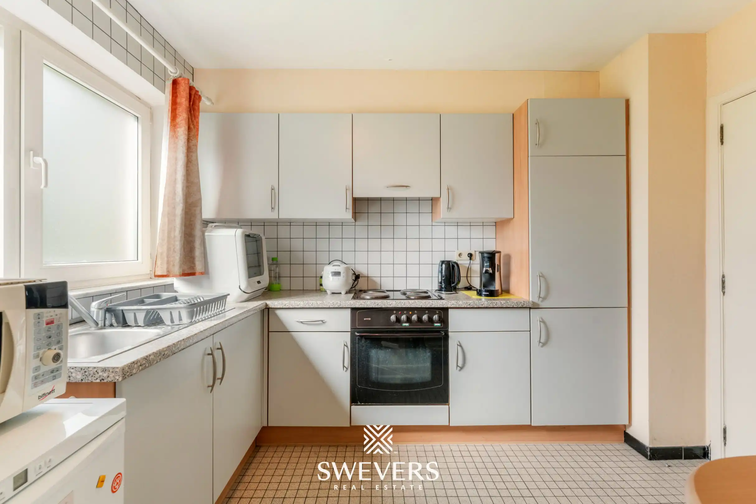 Ruim gelijkvloers 3-slaapkamerappartement inclusief autostaanplaats en kelderberging nabij Hasselt-centrum foto 11