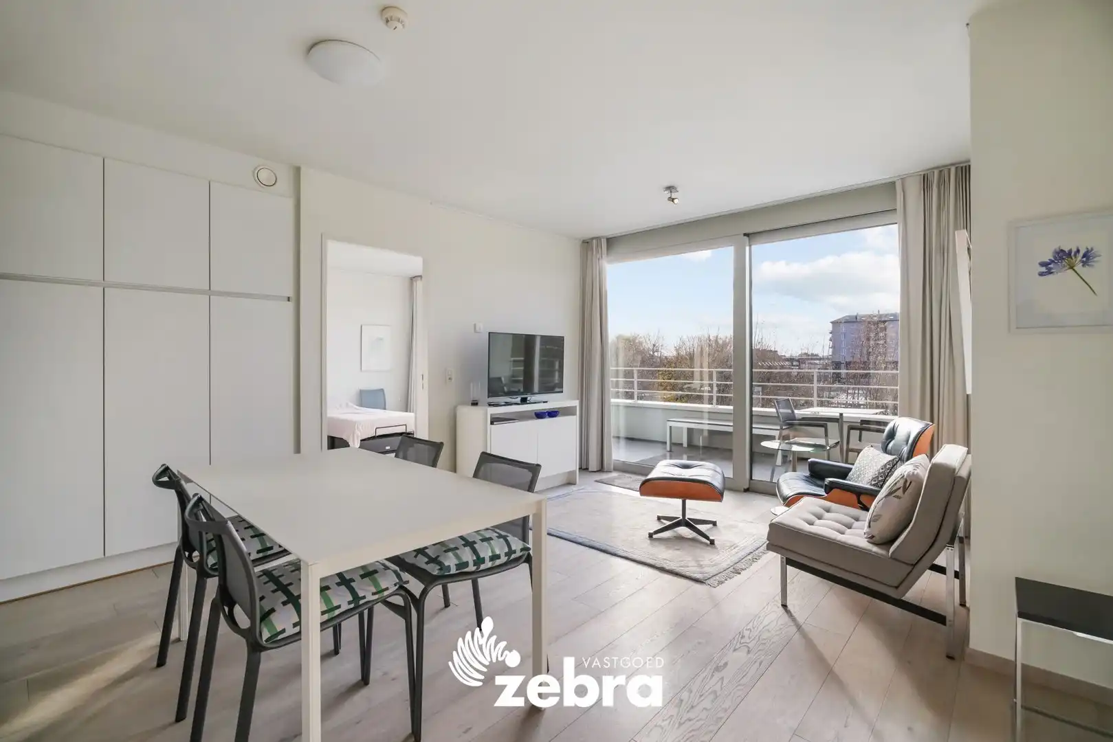 Moderne serviceflat met prachtig zicht op de Leie en autostaanplaats te Deinze! foto {{pictureIndex}}