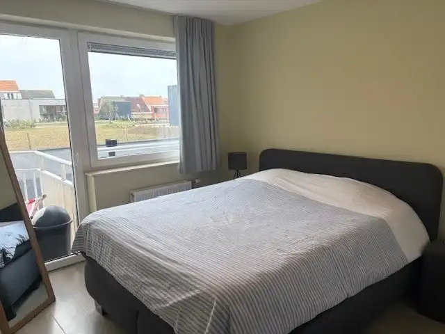 Ongemeubeld tweeslaapkamer-appartement in moderne residentie in Mariakerke foto 18