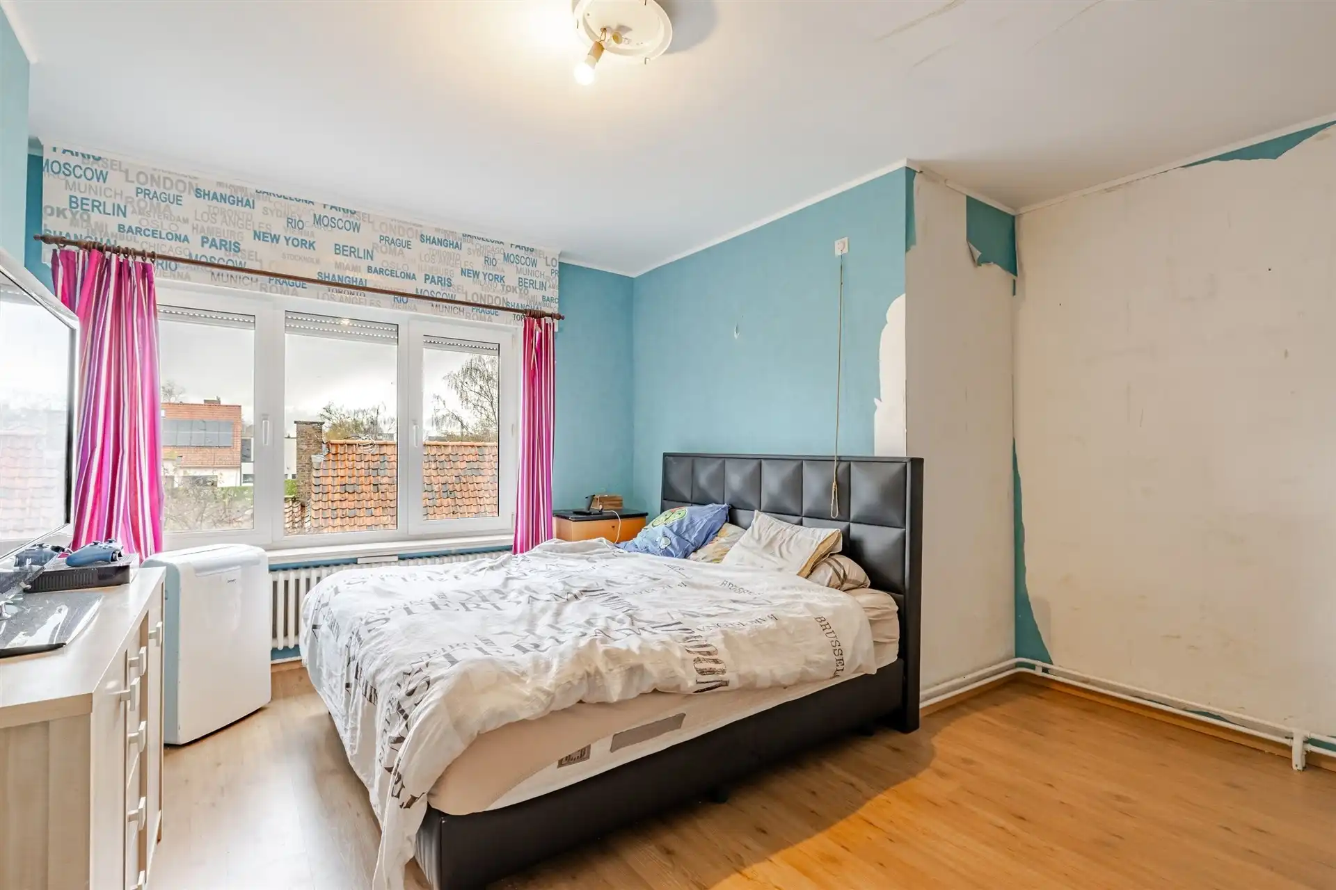 Op te frissen woning met supertoffe tuin, nabij het centrum! foto 12