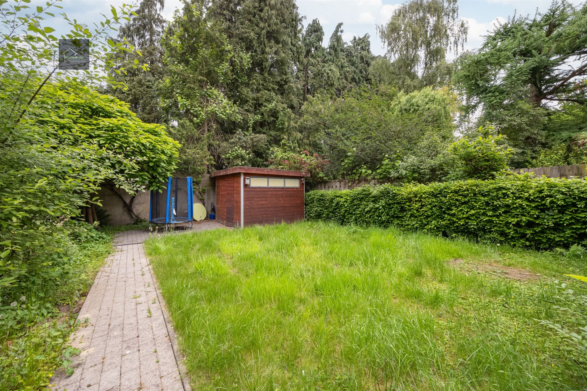 Gelijkvloers appartement met grote tuin en garage foto 11