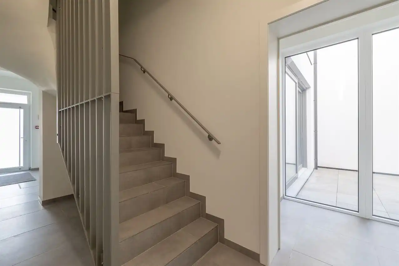 Nieuwbouwappartement met 1 slpk, autostaanplaats en terras foto 20