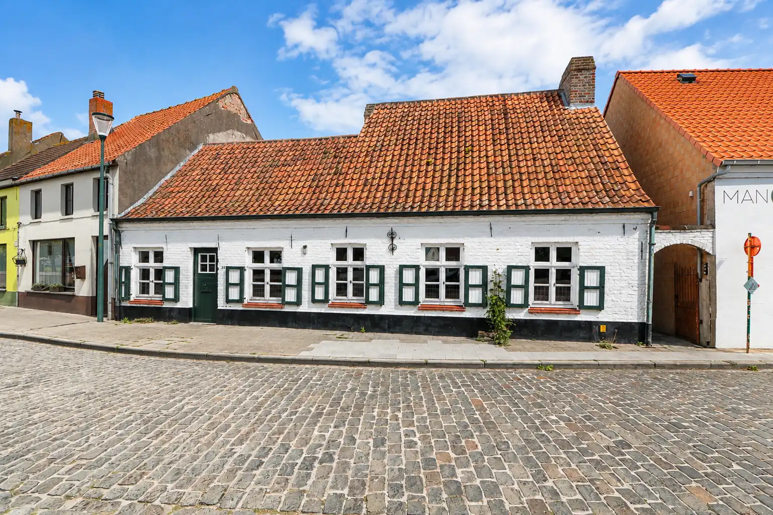 Uitzonderlijke woning met tuin, vlak aan het kerkpleintje van het charmante Nieuwmunster. foto 5
