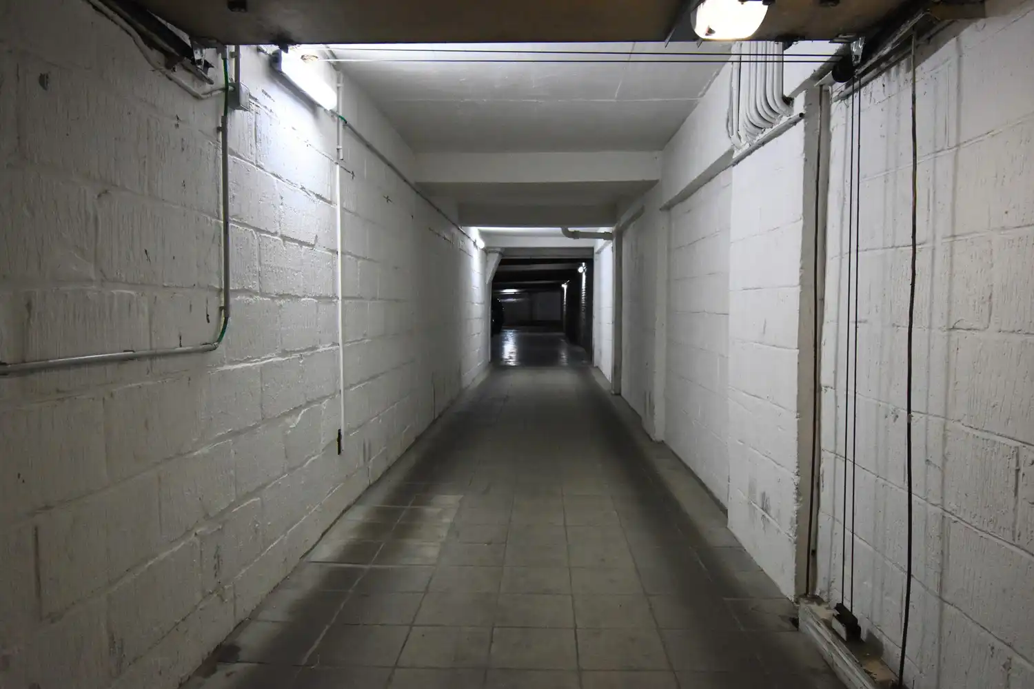 Overdekte staanplaats in gemeenschappelijke garage centraal gelegen tussen Avenue Louise en Hallepoort foto 3