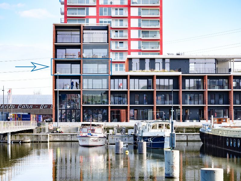 Ruim 2slpk-appartement met zuid-west georiënteerd terras aan de ‘Nieuwe Dokken’. Een appartement met een fenomenaal zicht over het water en de Gentse skyline! foto 12
