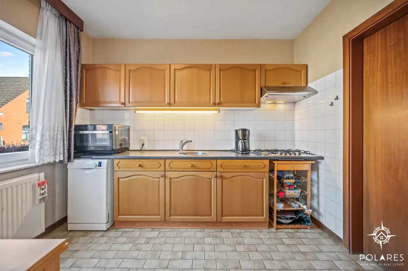 Ruim gelijkvloers appartement met 2 slaapkamers, garage en kelder foto 7