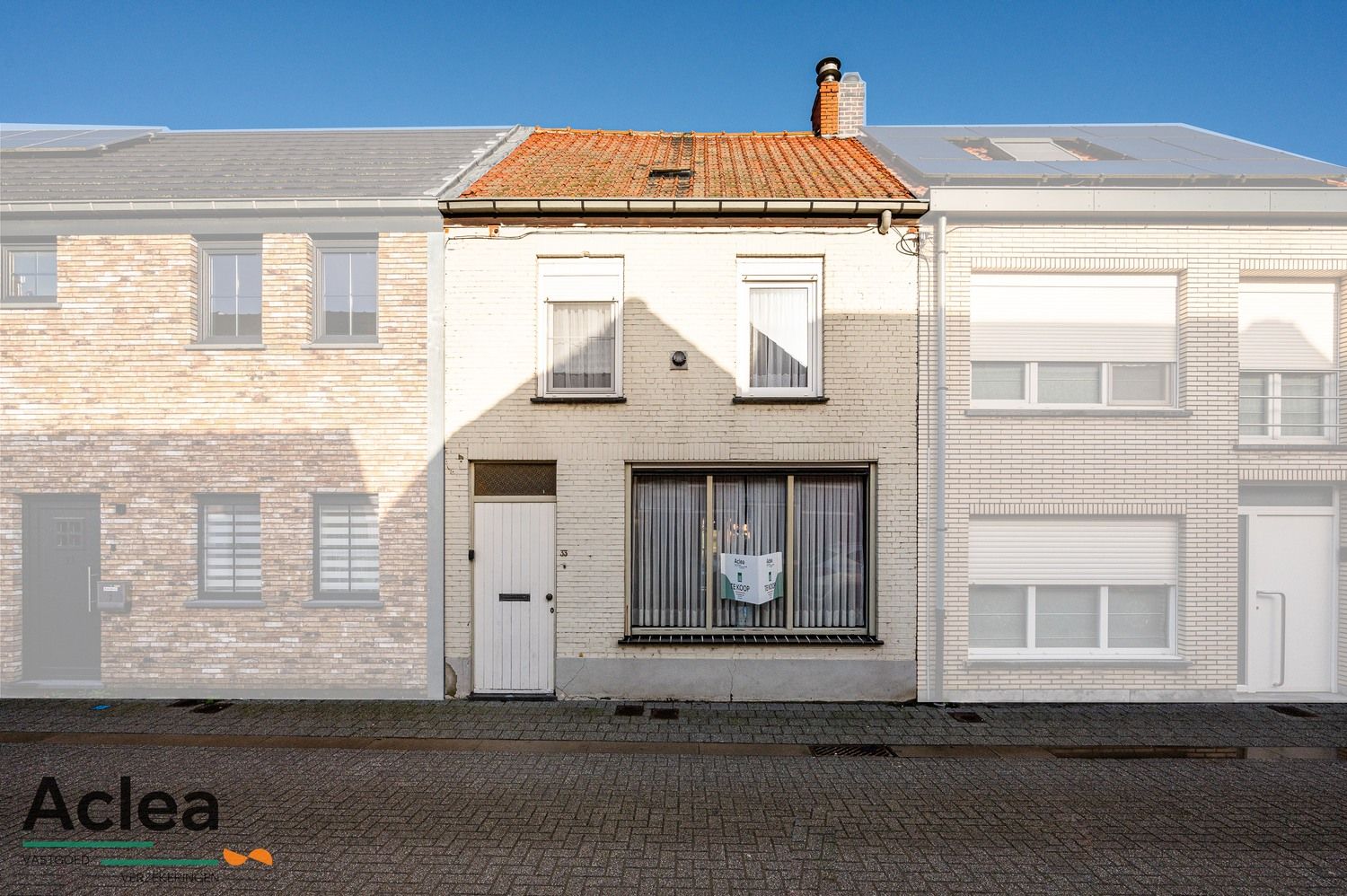 Te renoveren woning met 3 slpks, diepe tuin en garage achteraan met uitweg foto 1