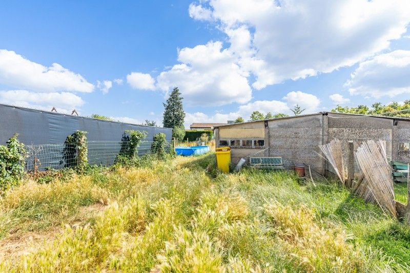 Te renoveren woning met tuin en garage op een perceel van 6are 39ca foto 18