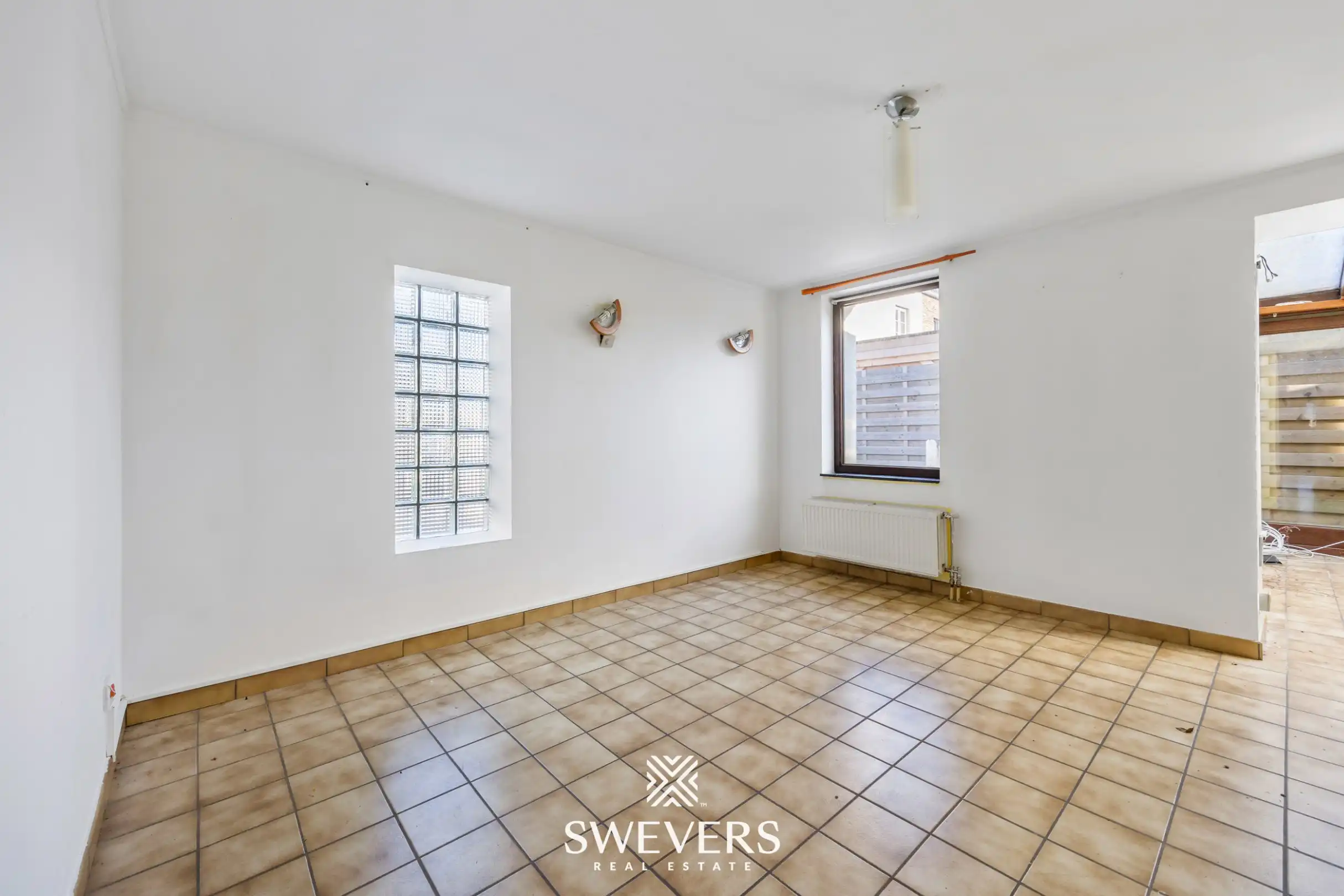 Te renoveren open bebouwing met ruime volumes en zuidgericht perceel in Heusden   foto 8