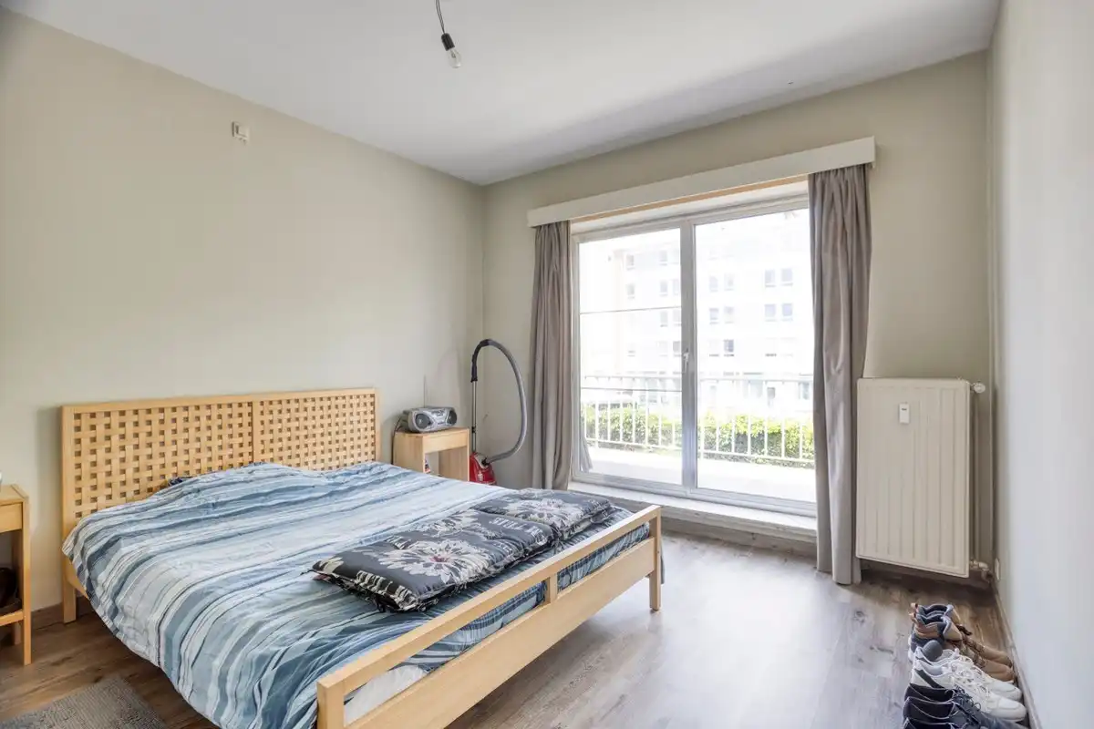 Opbrengsteigendom met 3 appartementen, garages en tuin foto 16